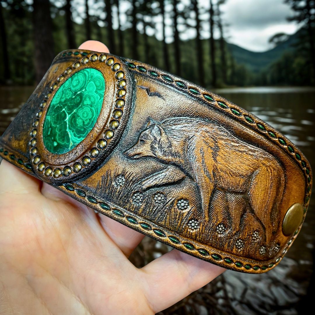 Tooled leather wolf bracelet with malachite cabochon