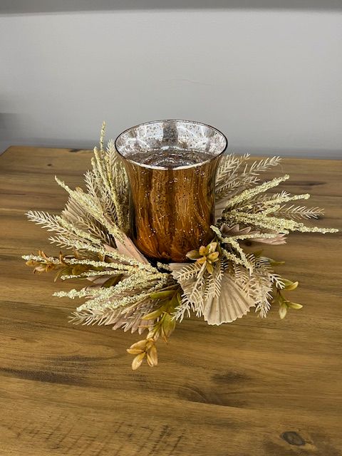 ORANGE VOTIVE ON LEAVES