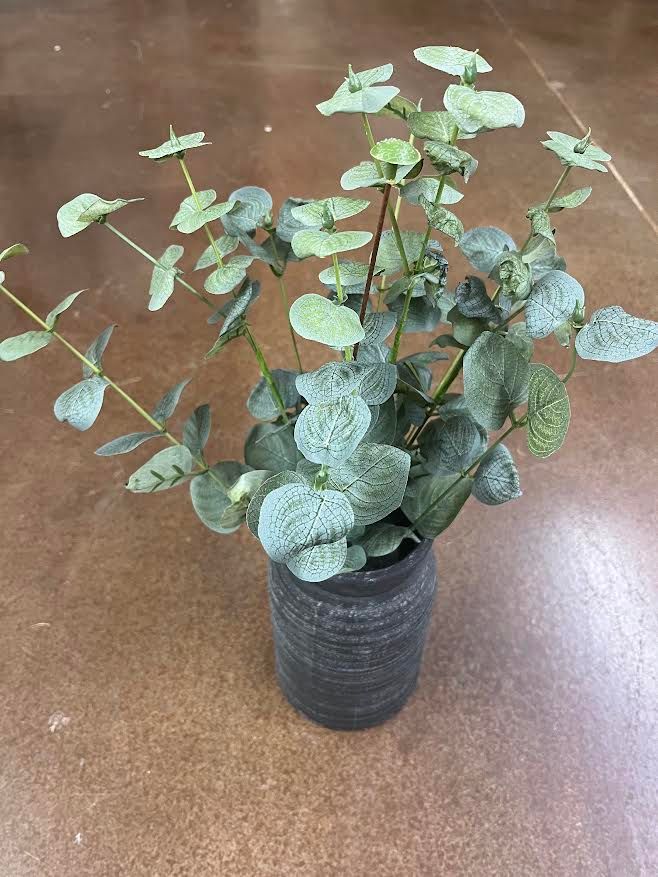 Greenery in black vase