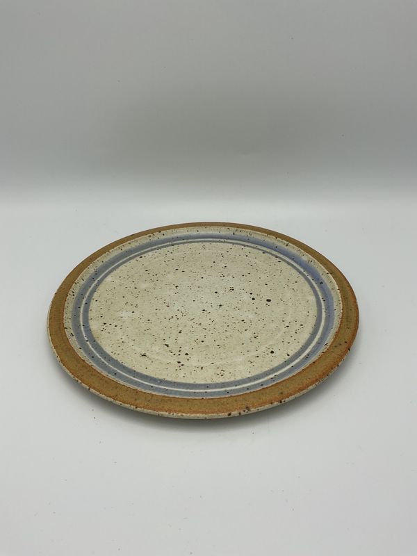 Kelly McCarty stoneware plate, blue &amp; brown ring on cream
