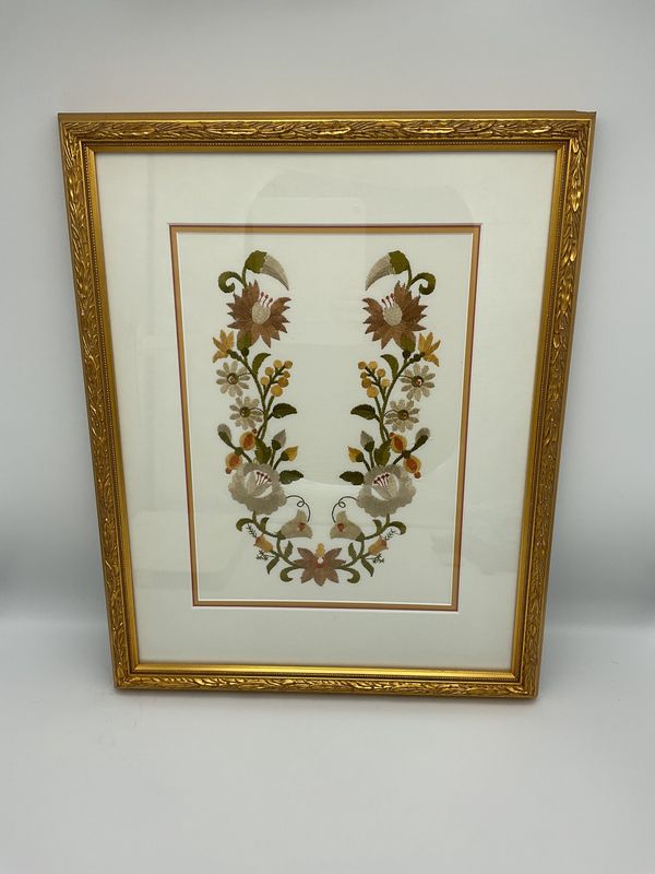 Floral embroidery in gold frame