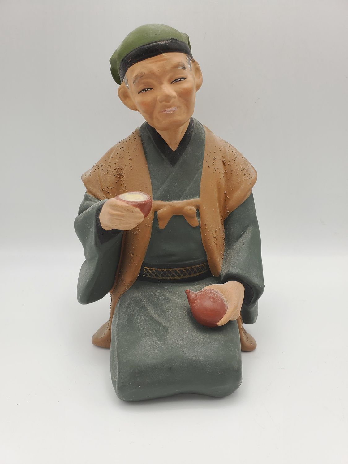 Hakata Urasaki Old man holding teapot and cup