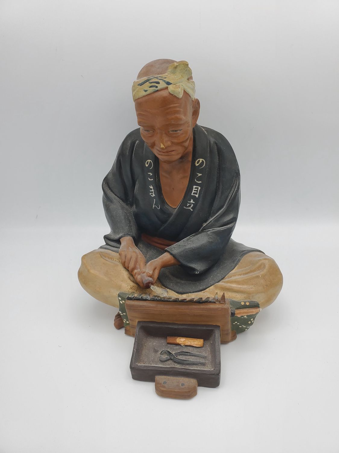 Hakata Urasaki knife sharpener figurine