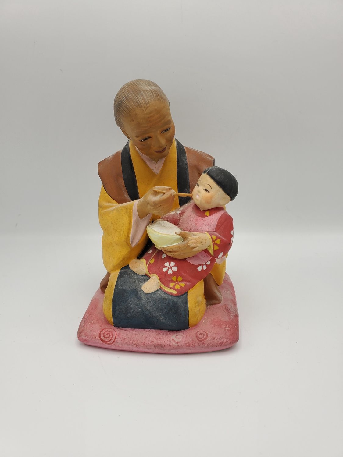 Hakata Urasaki feeding child