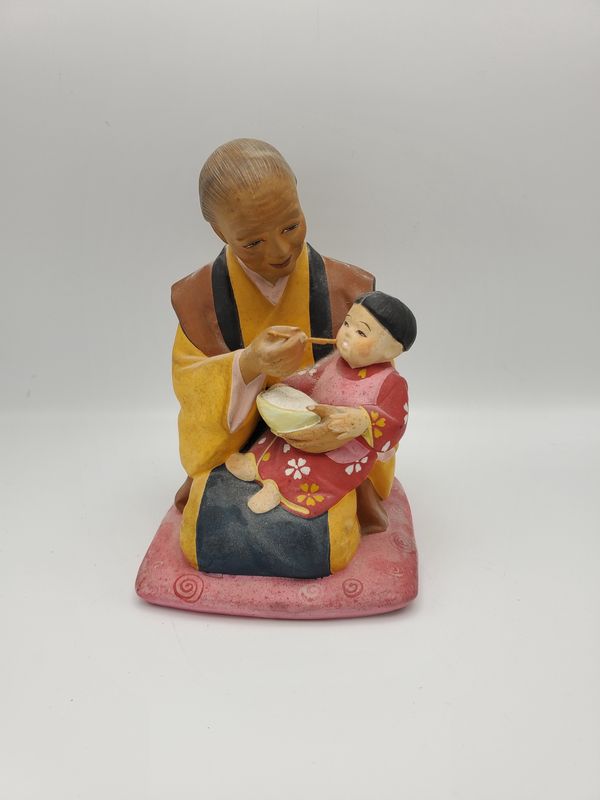 Hakata Urasaki feeding child
