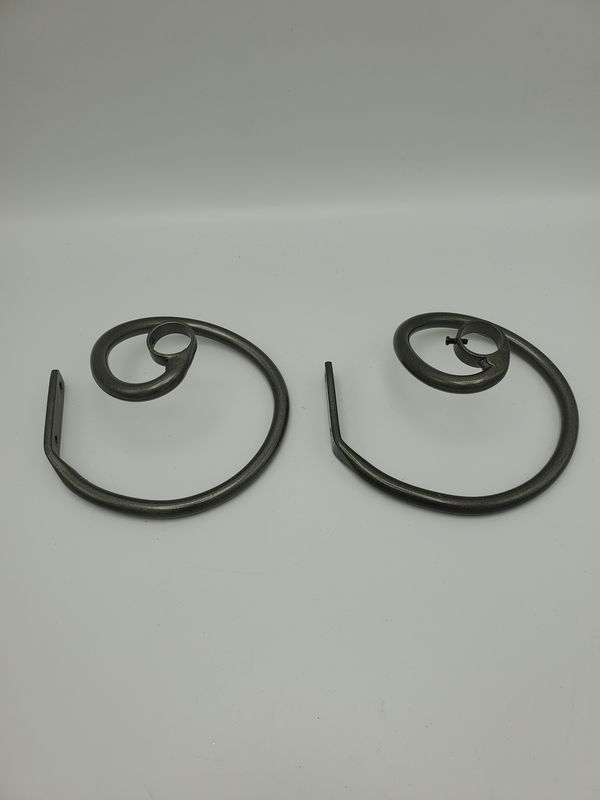 Swirl iron curtain rod holders