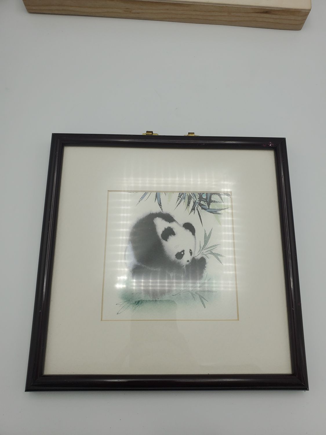 Panda watercolor framed, hunched over