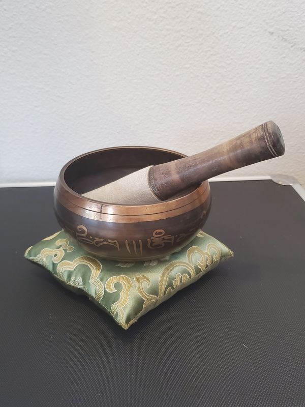 Small singing bowl on pillow