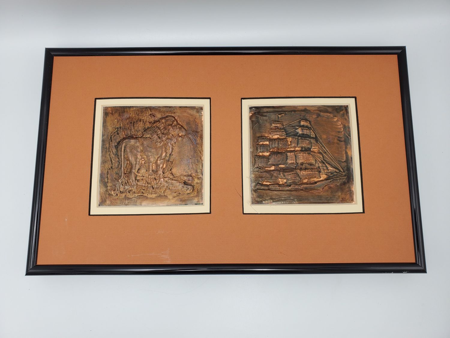 Copper lion and ship plate framed