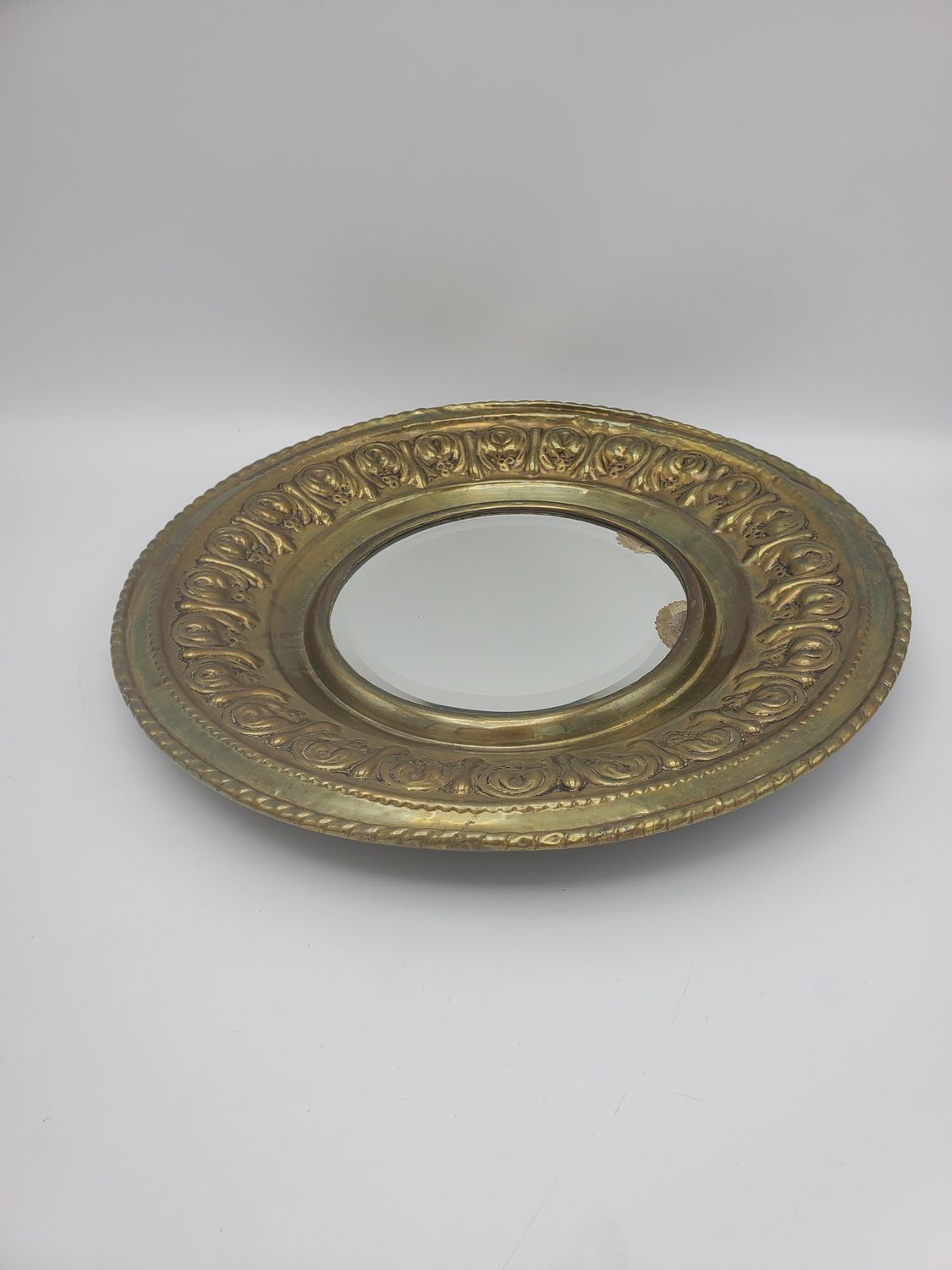 Ornate gold circle mirror plate