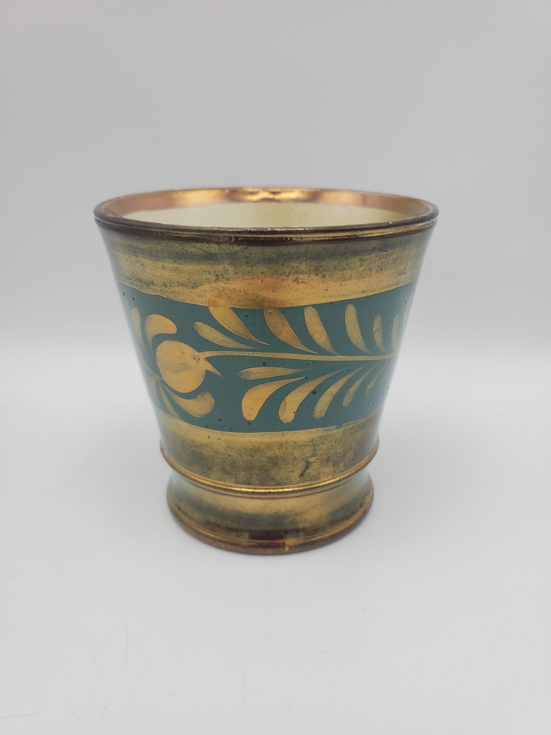 Copper lusterware blue leaf cup