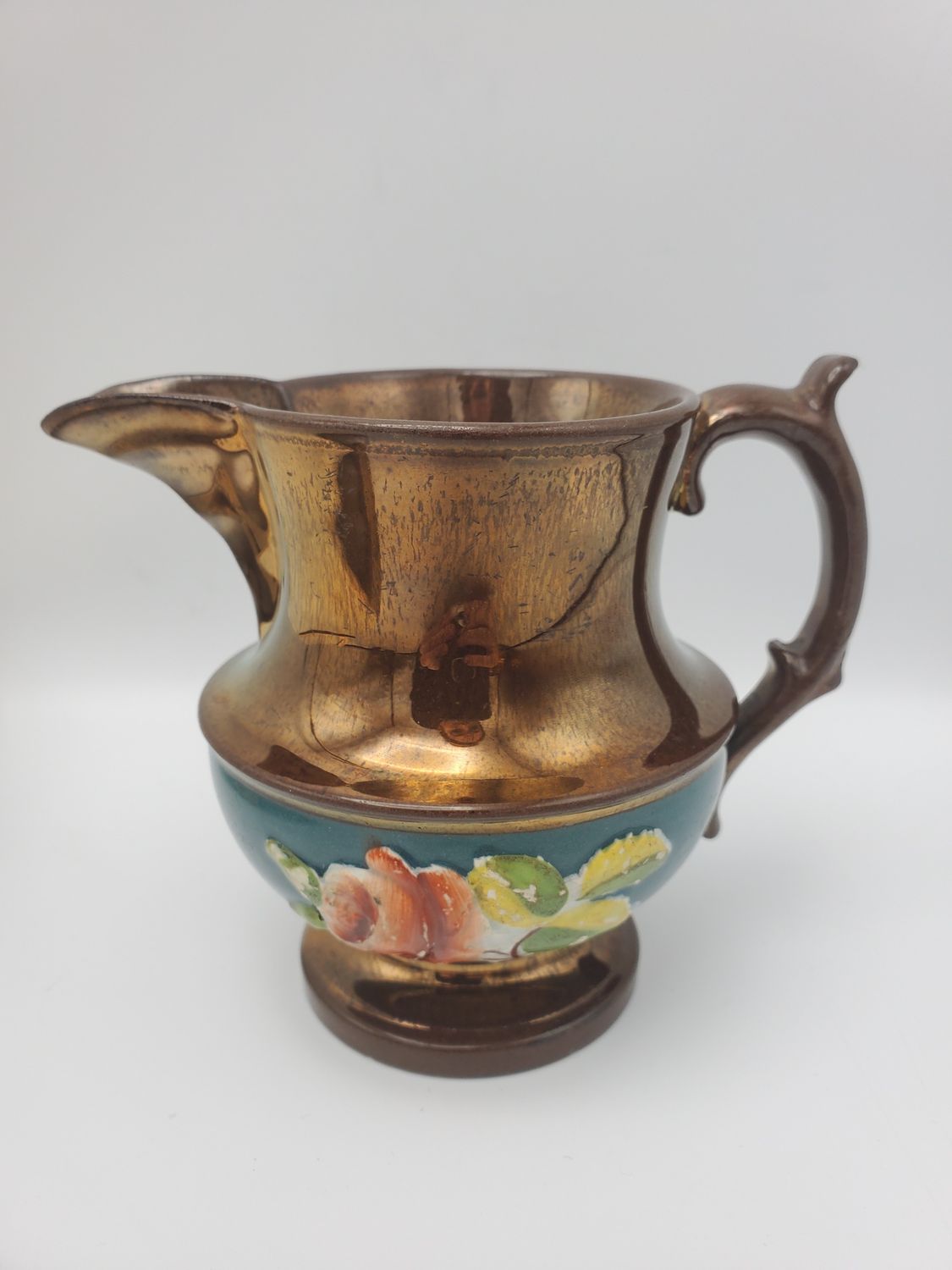 Copper lustre floral relief creamer