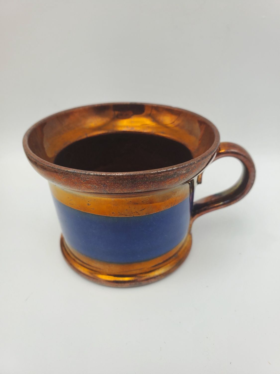 Copper lustre antique solid blue band cup