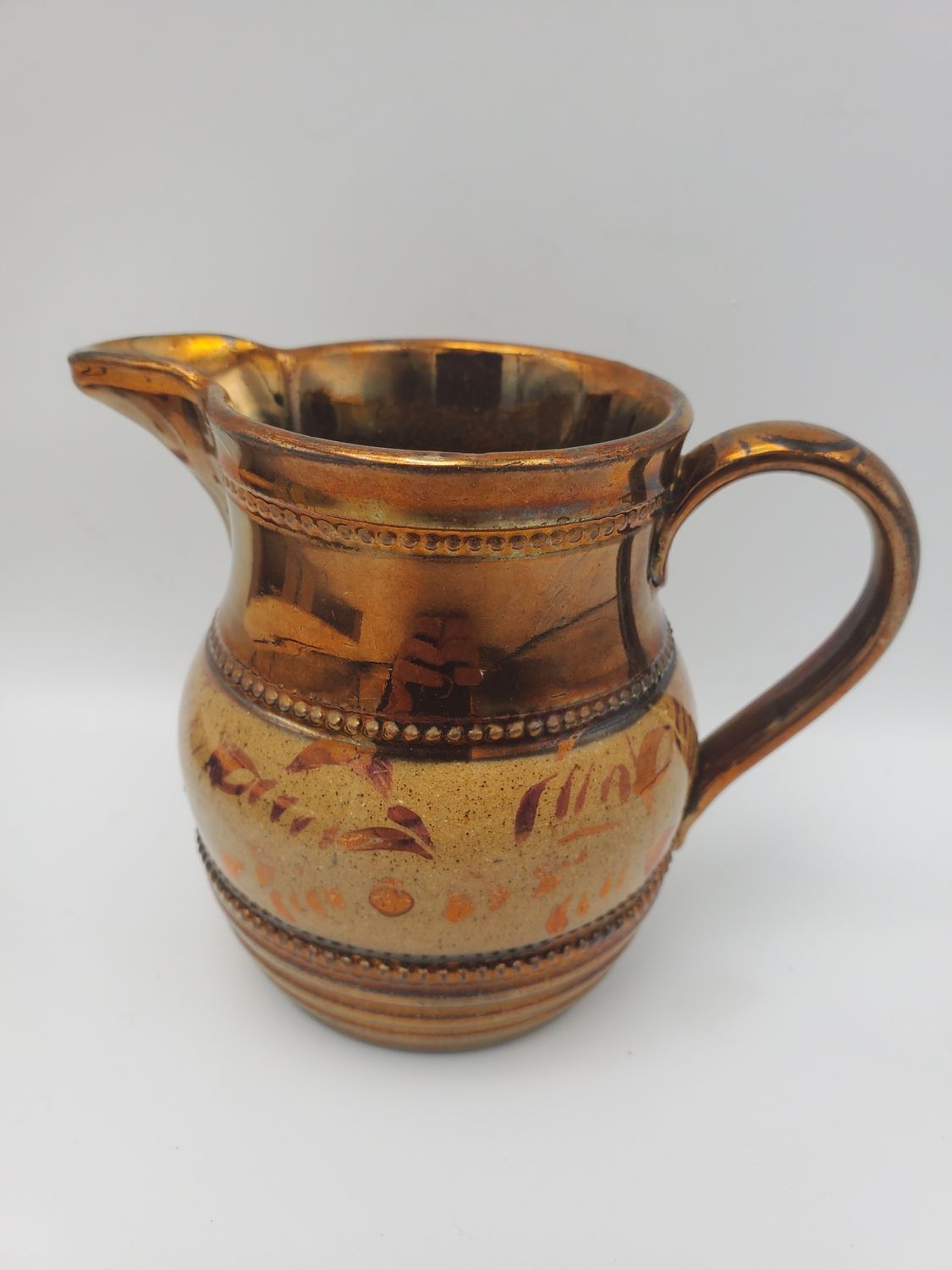 Copper lustre antique tan studded creamer
