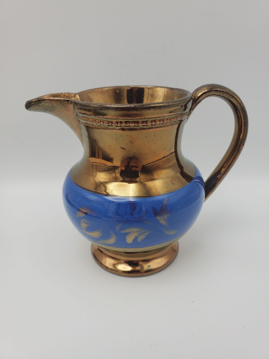 Copper lustre blue leaves band creamer