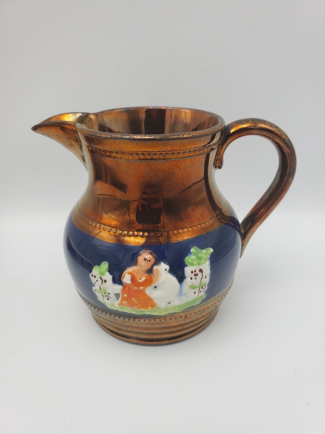 Copper lustre girl sheep creamer