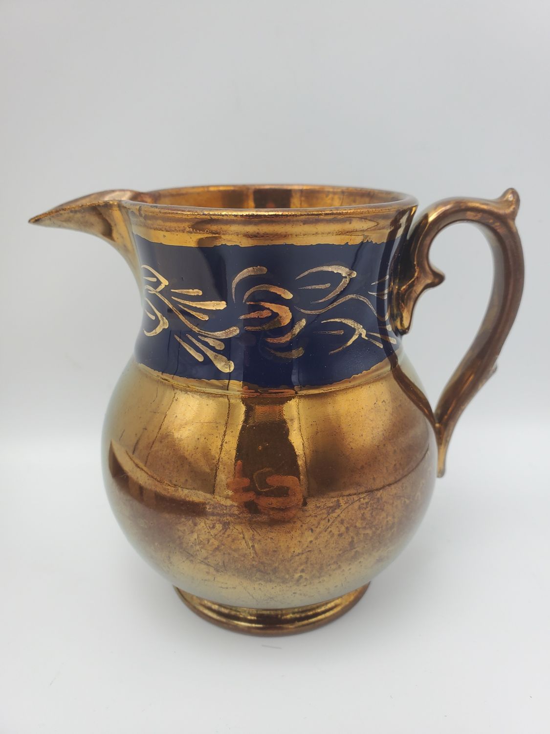 Copper lustre dark blue band creamer