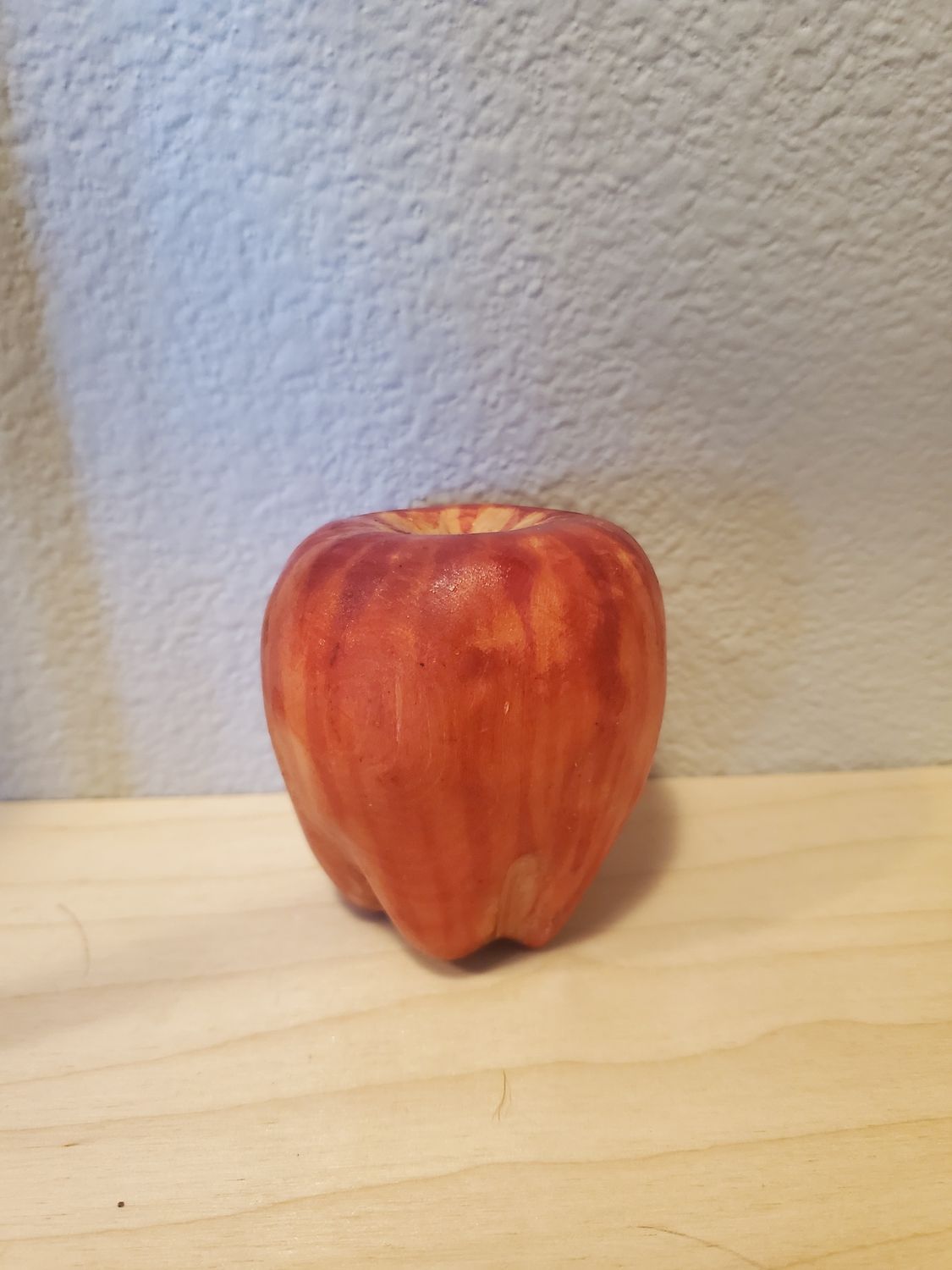 Wooden apple, missing stem