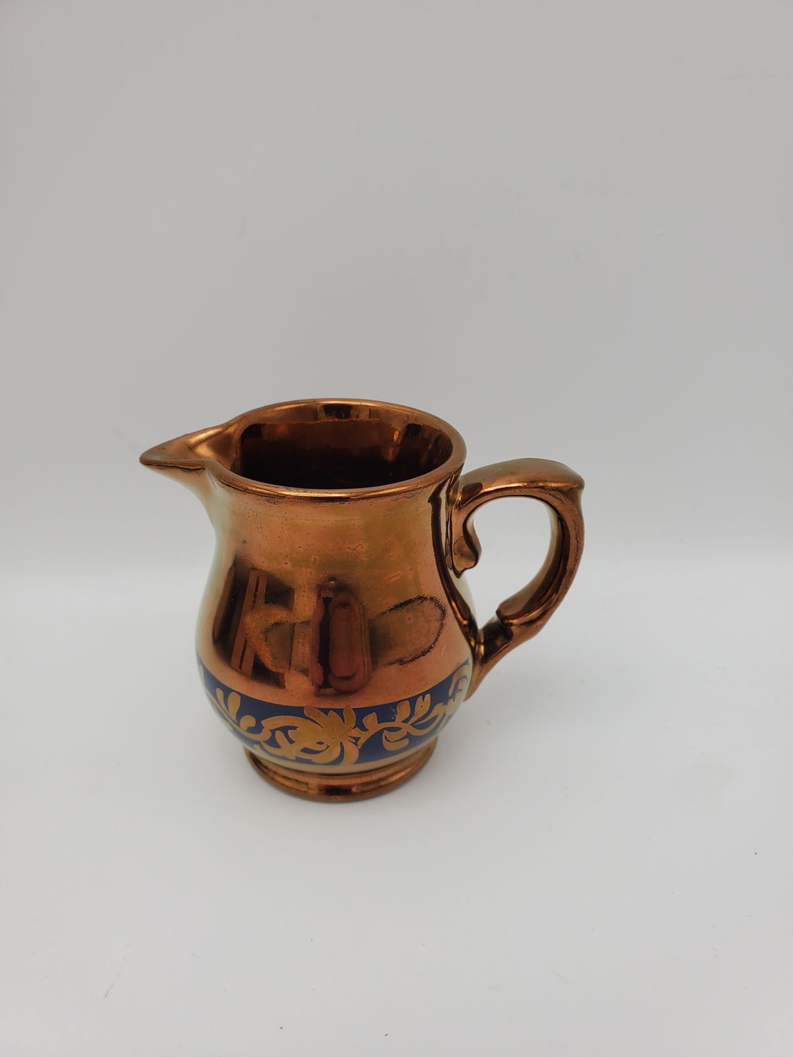 Copper lusterware small blue flrl band creamer