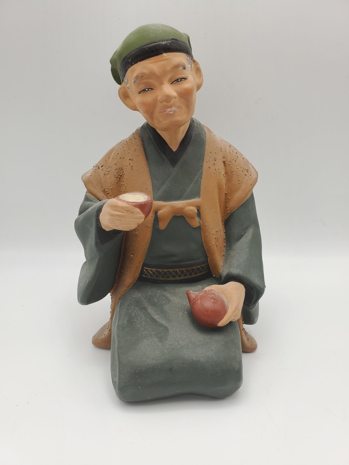 Hakata Urasaki Old Man Holding Teapot and Cup