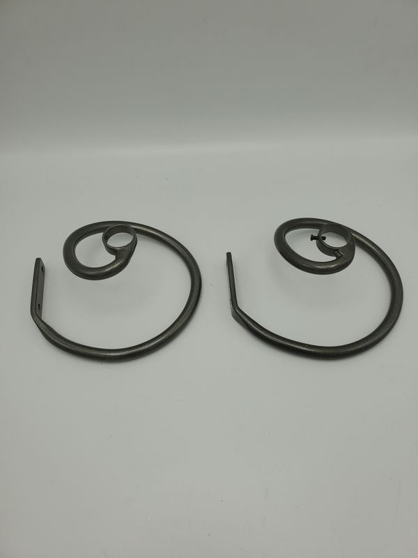 Swirl iron curtain rod holders