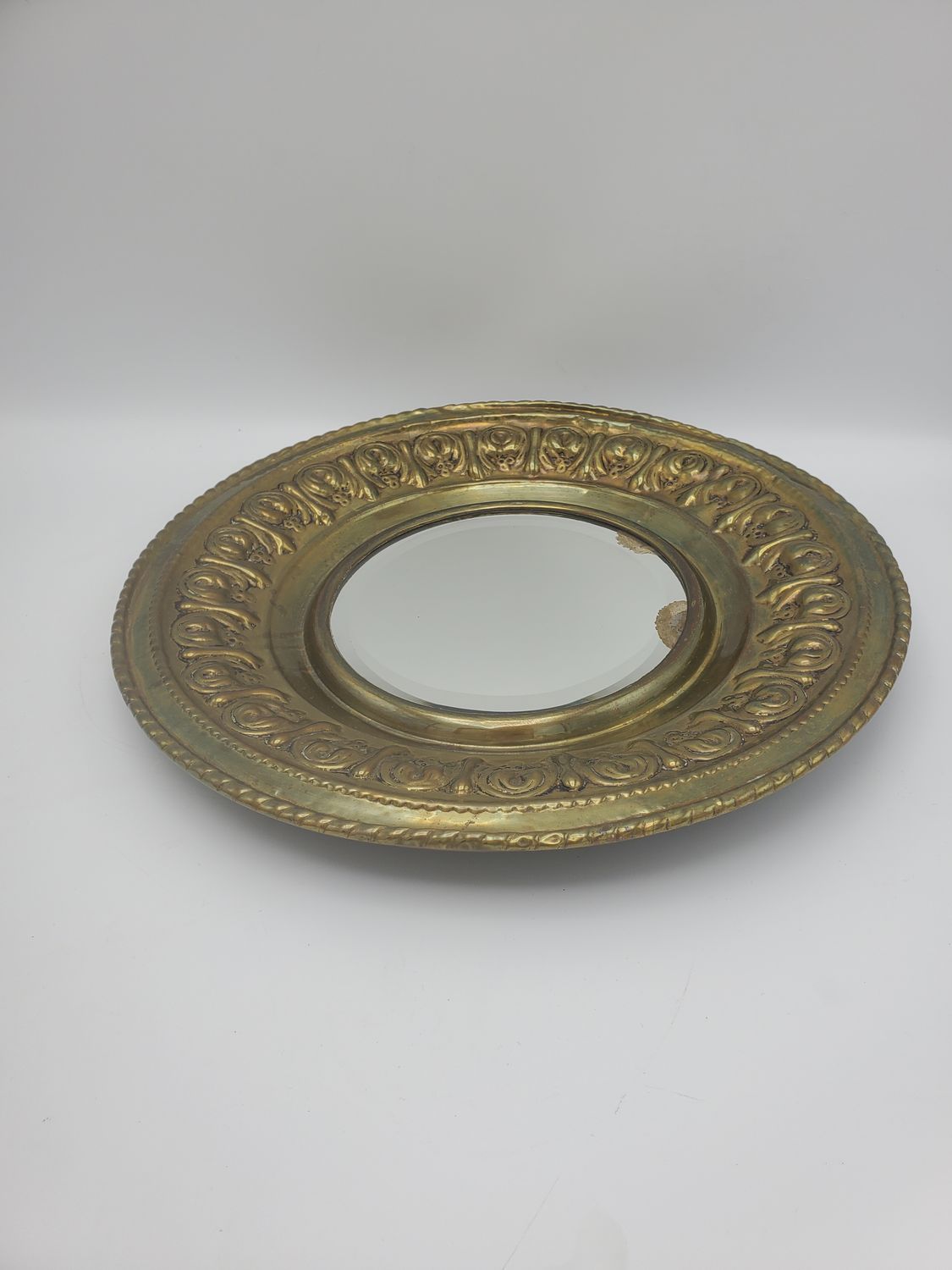 Ornate gold circle mirror plate
