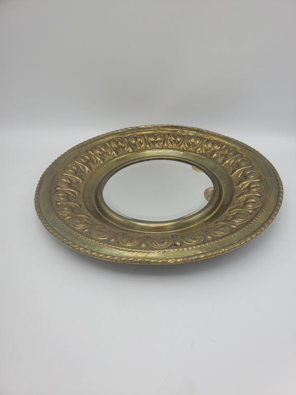 Ornate gold circle mirror plate