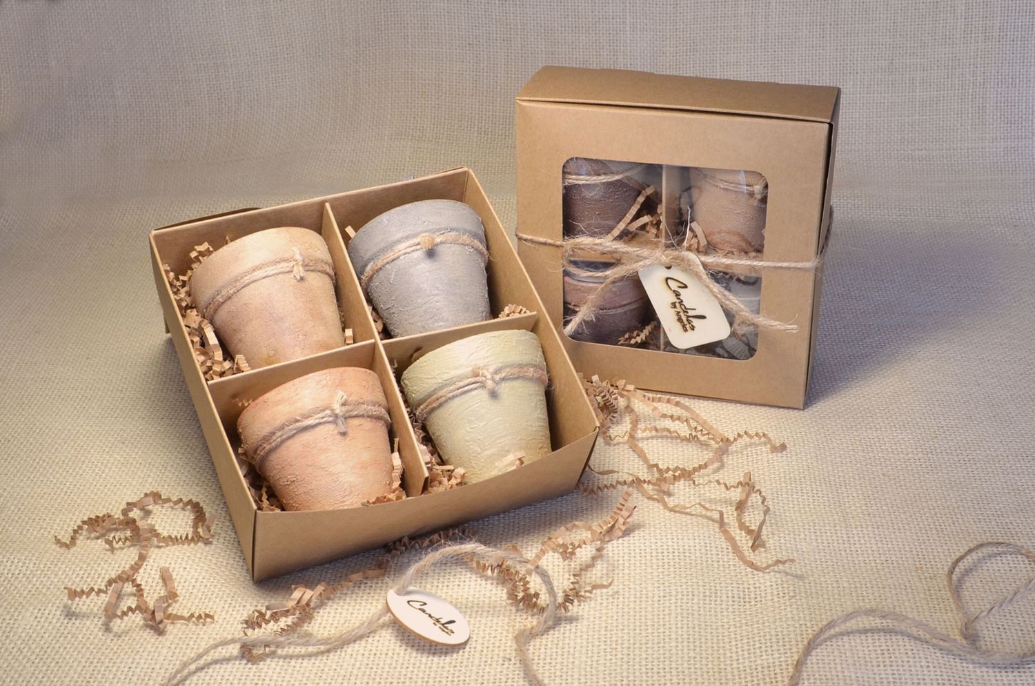 Gift set of 4 hand-painted terracotta candles, made with a soy–coconut wax blend (3 oz each). Available in 13 fragrances/colors, gracefully packaged for a thoughtful, tasteful gift.