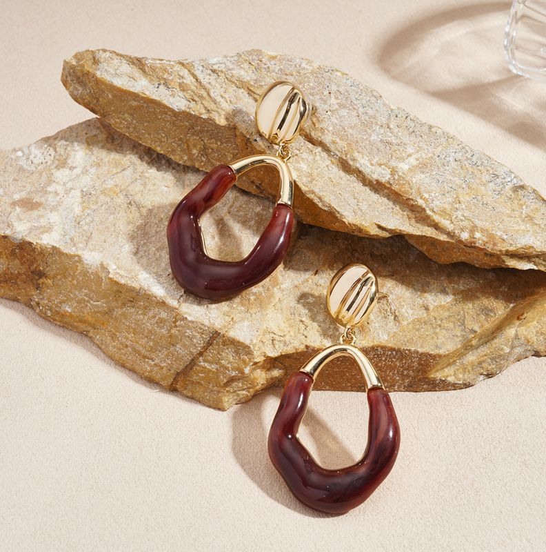 Oorbellen | Resin drop | Goud &amp; burgundy | Stainless steel