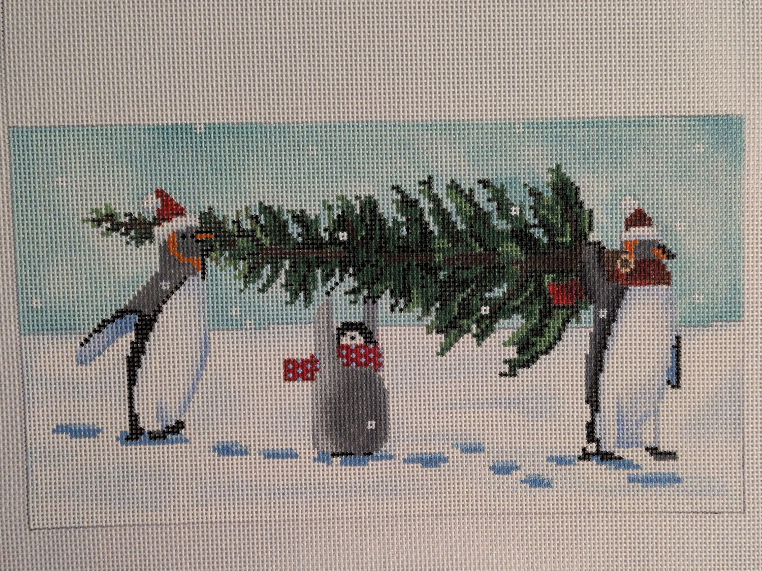 Penguins Bringing Home the Tree