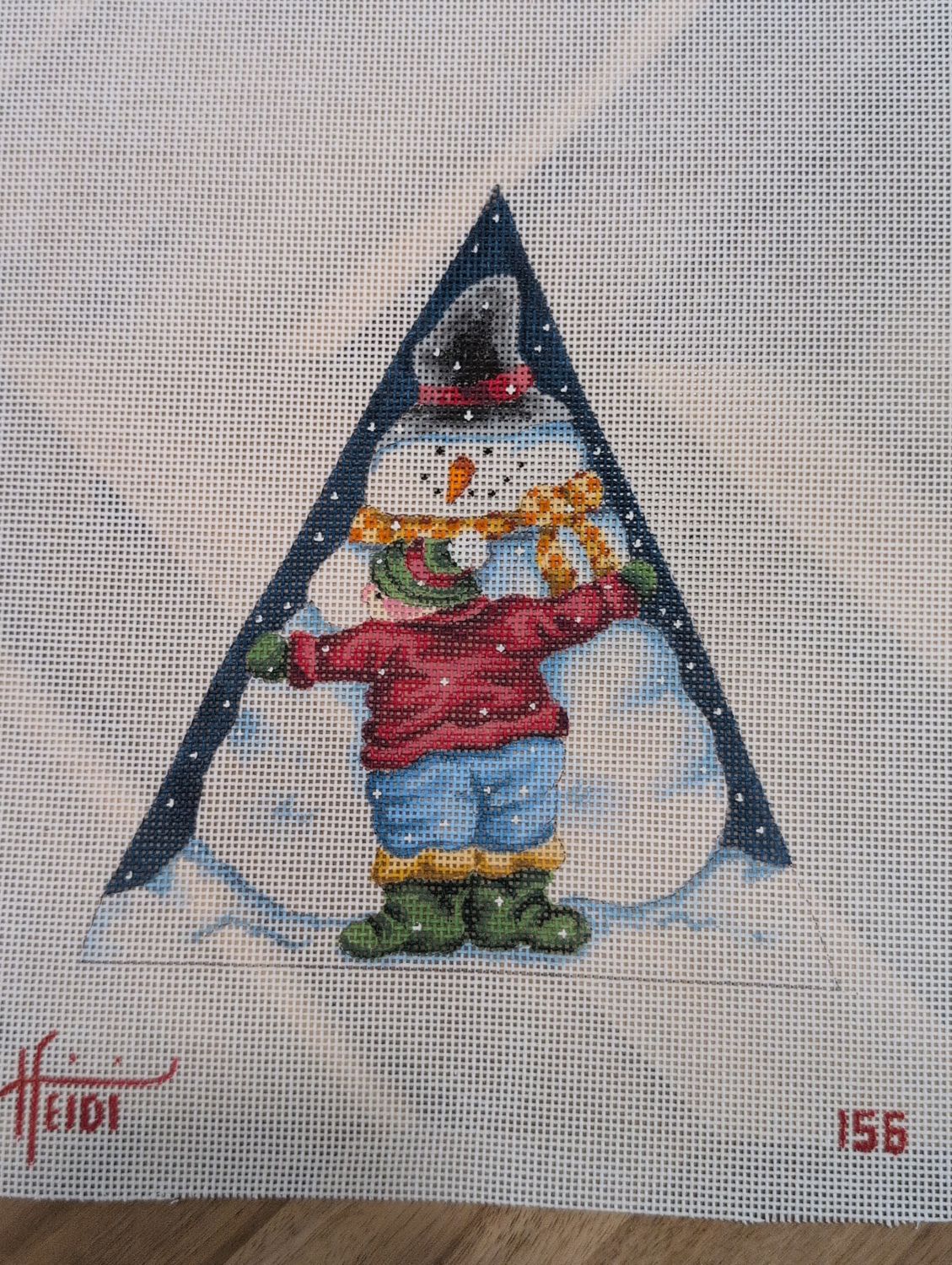 Boy Hugging Snowman