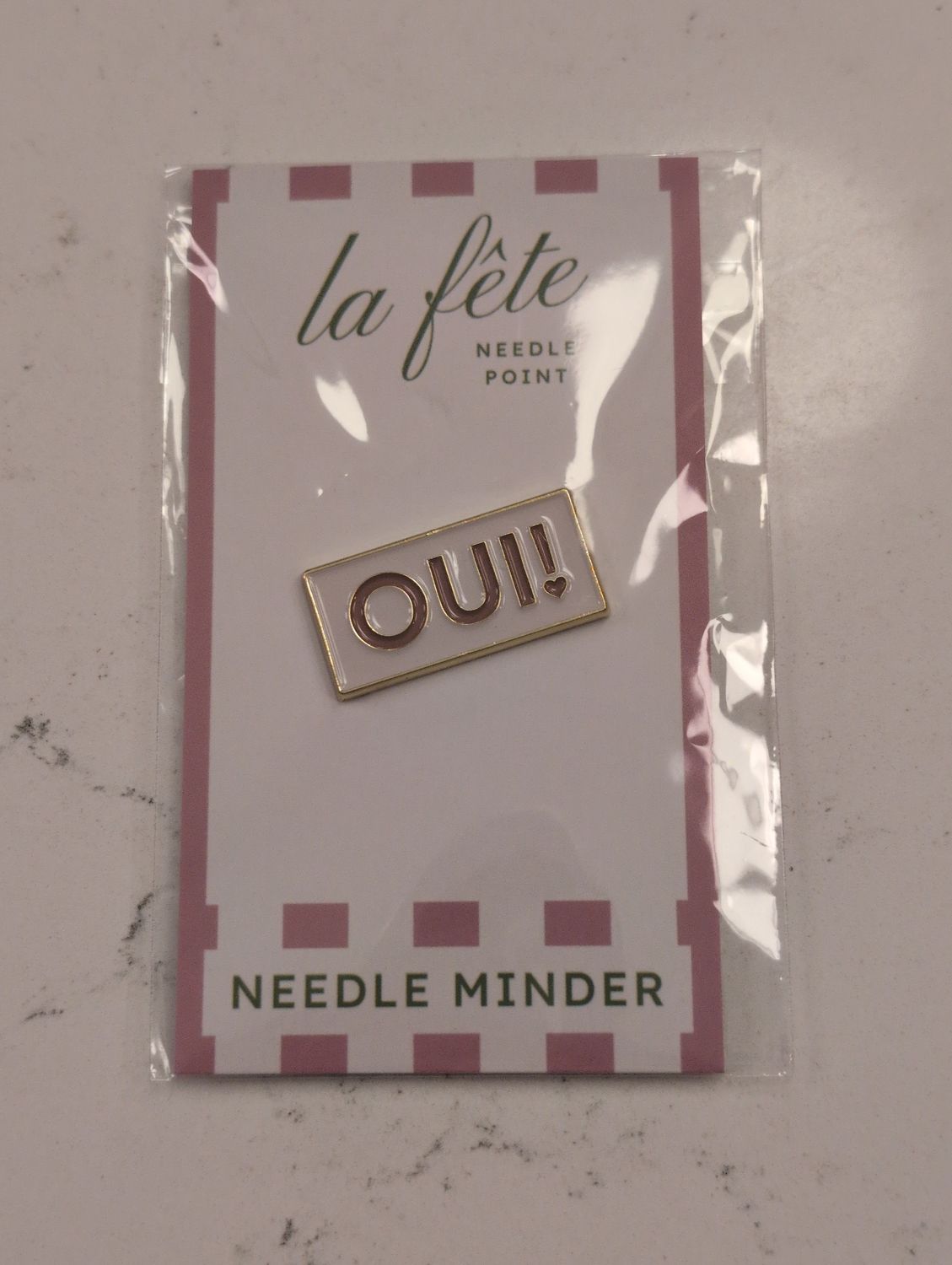 Oui! Needle Minder