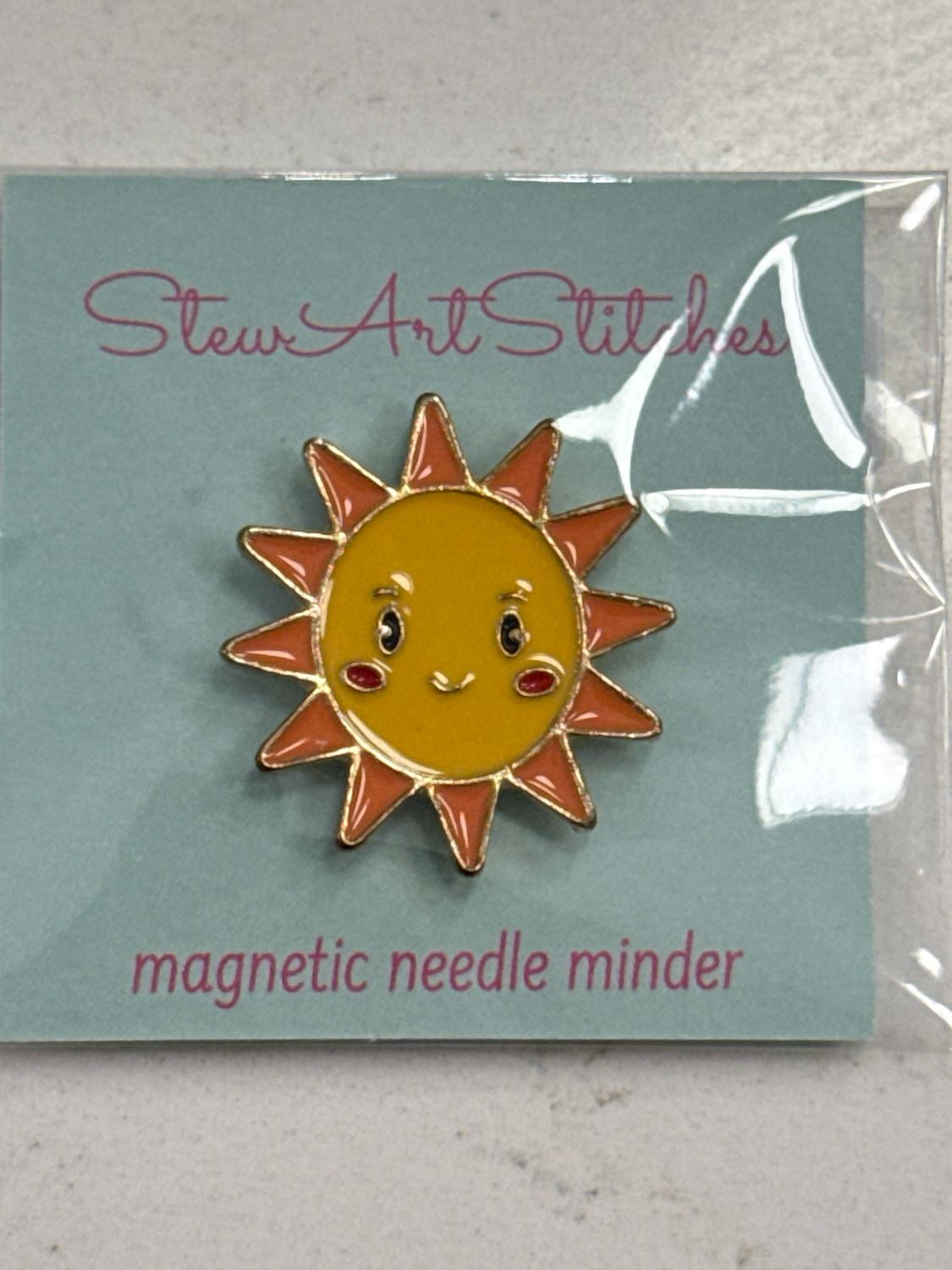 Sun Enamel Needle Minder