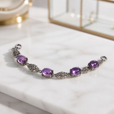 Amethist armband met sierlijke zilverkleurige details