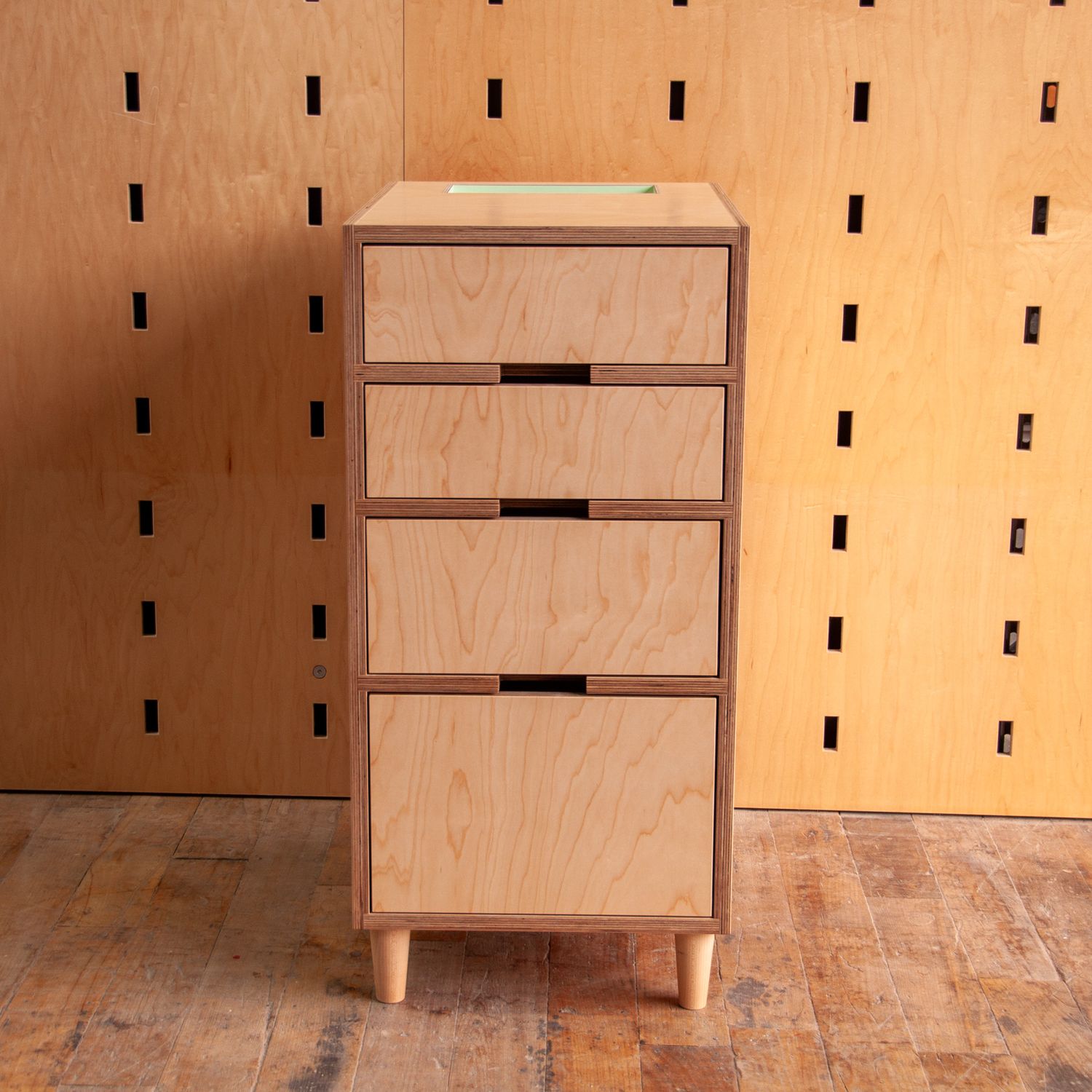 4 drawer cabinet with a green cubby