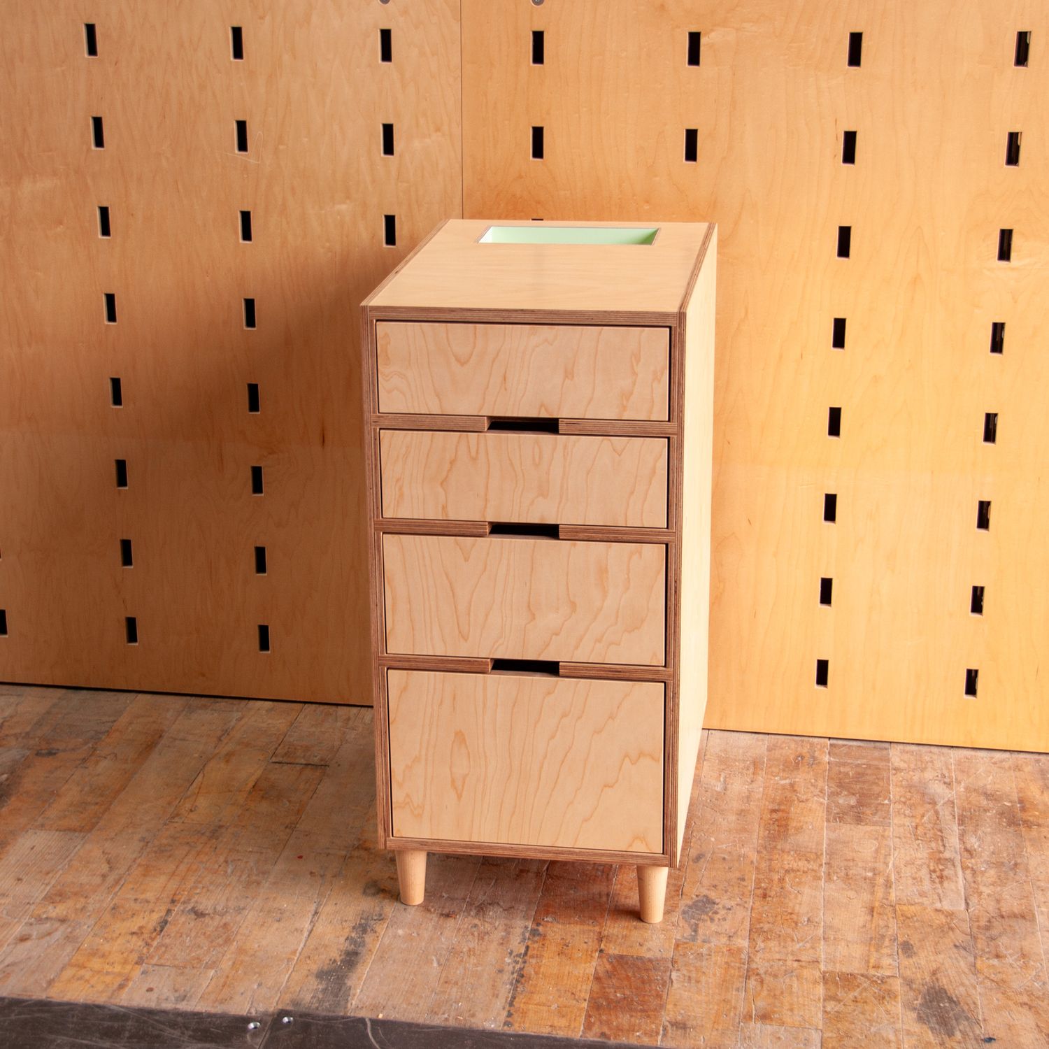 4 drawer cabinet with a green cubby