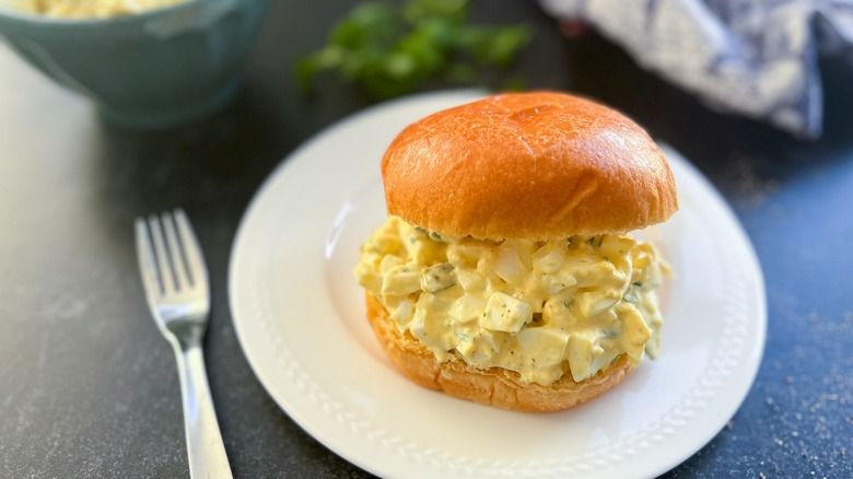 Meat-Egg Salad on a Brioche Bun with Cucumber Salad