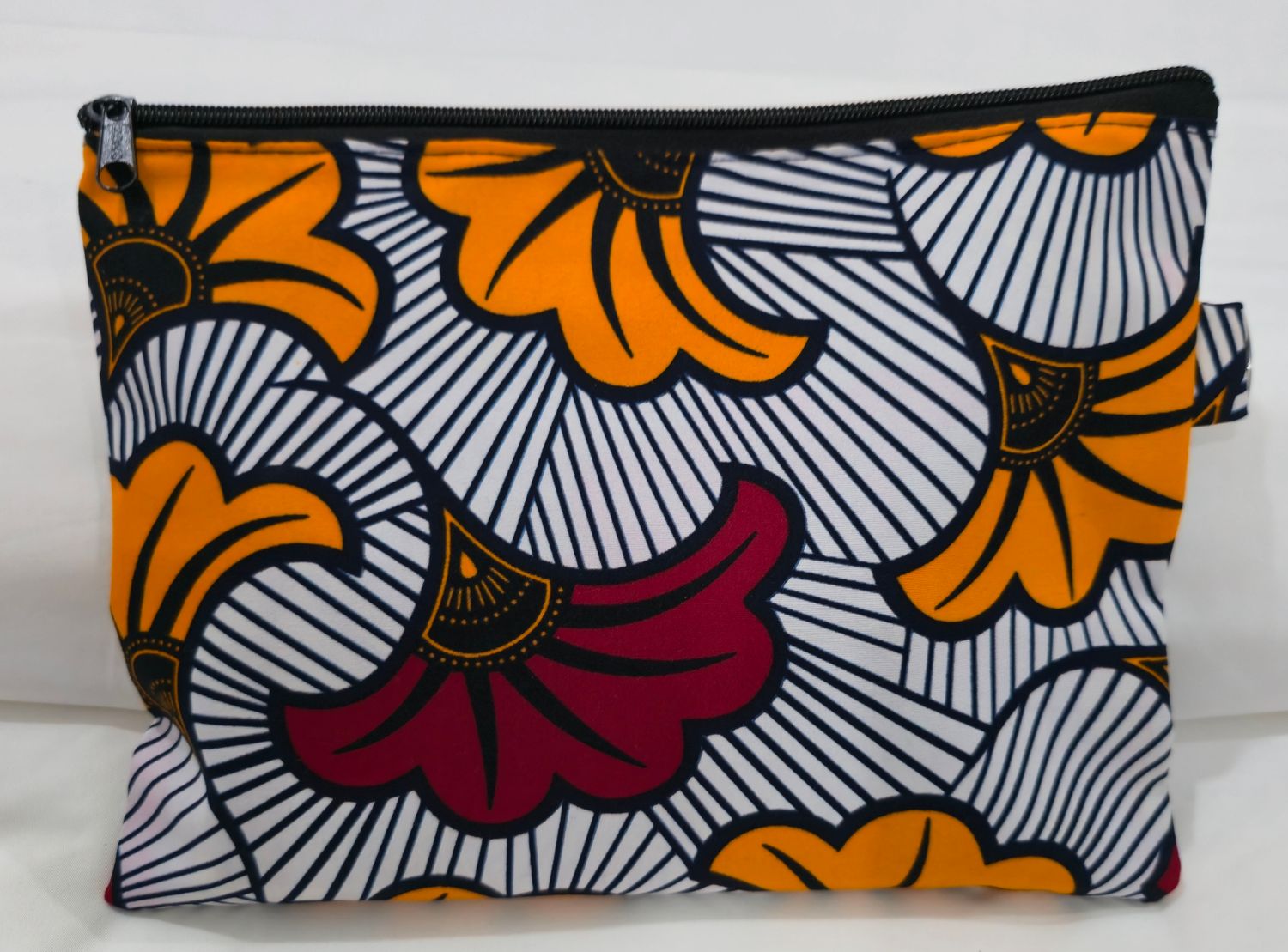 Pochette en Wax fleur de mariage orange et rouge Pochette en Wax fleur de mariage orange et rouge