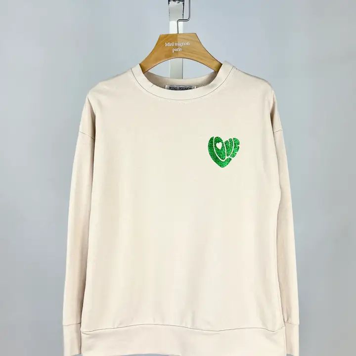 Trui beige met groen glittermotief