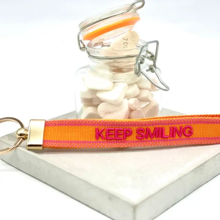 Sleutelhanger, Keep smiling, oranje/fuchia
