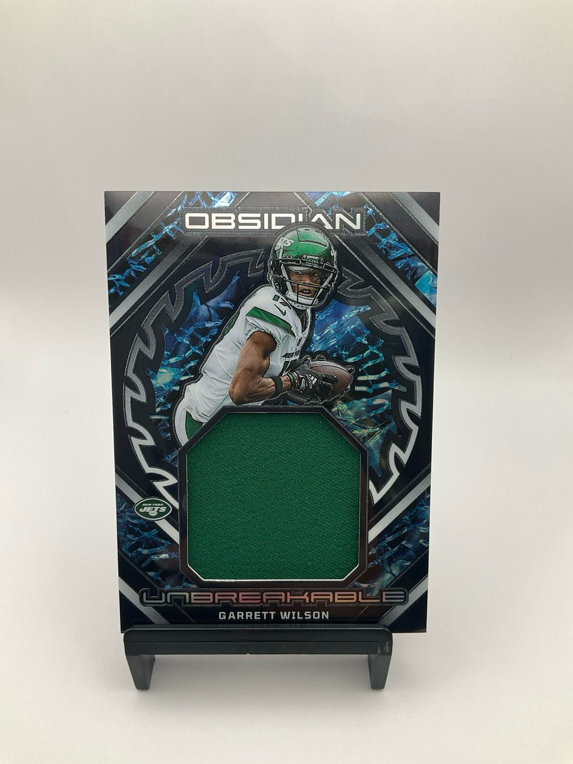 2023 Panini Obsidian Garrett Wilson Unbreakable Patch 023/199