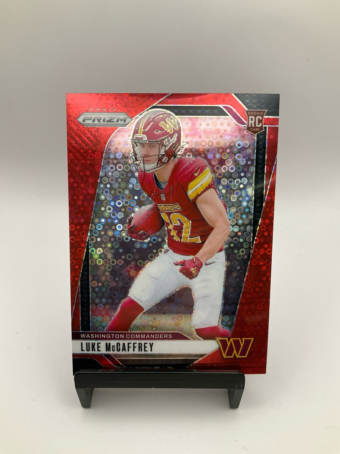 2024 Prizm Football RC Luke McCaffrey Red Disco No Huddle Prizm /75