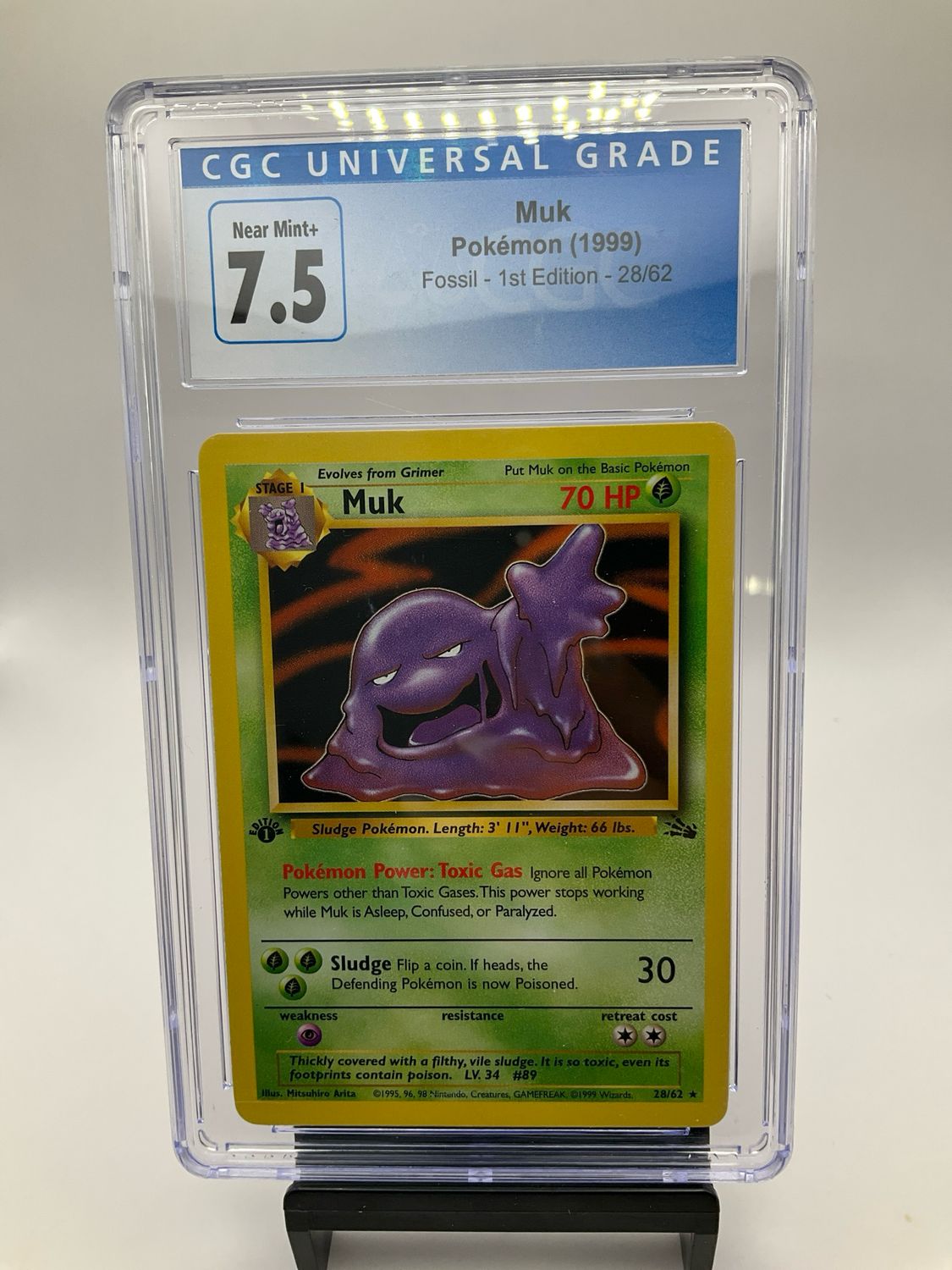 1999 POKEMON FOSSIL 1ST EDITION MUK 28/62 CGC 7.5