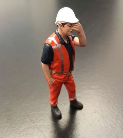 Pascal has a headache.Orange safety jacket with helmet Hand painted detailed diorama figure in overall