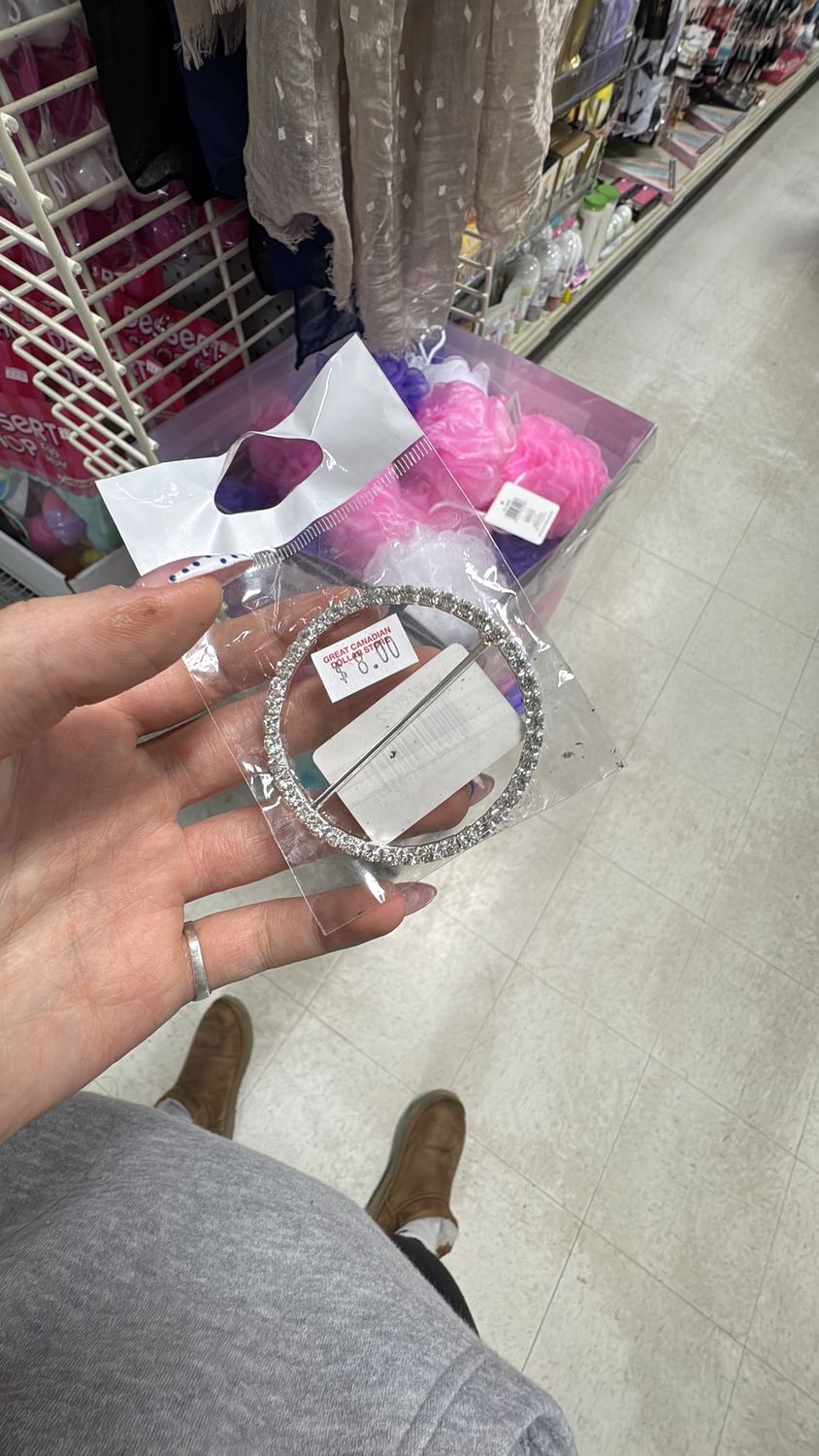 large shiny belt buckle circle