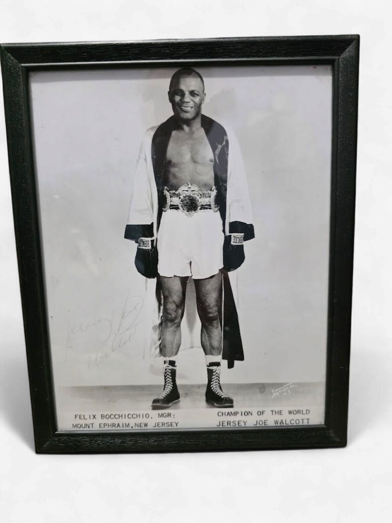 Jersey Joe Walcott, photographed while wearing the Heavyweight Championship belt.  Auto
