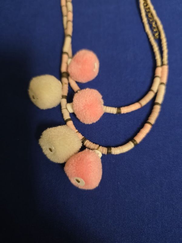 Mia Collection peach and cream beaded necklace featuring pom-poms