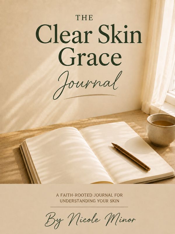The Clear Skin Grace Journal by Nicole Minor cover with an open journal, pen, and tea in warm natural light