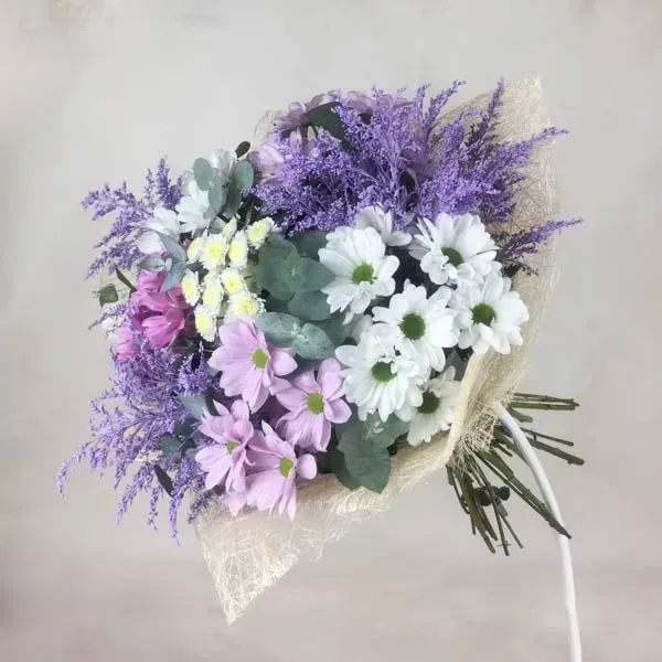 The bouquet is made with colorful chrysanthemum and solidago.