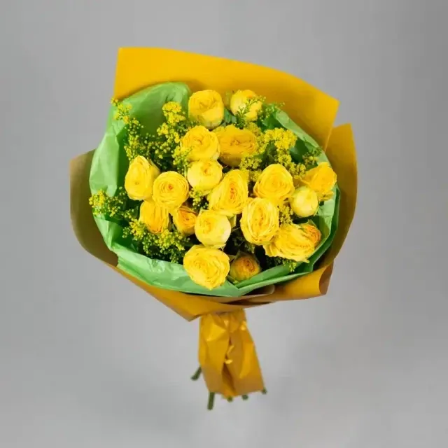 The bouquet is made with yellow spray roses and solidago.